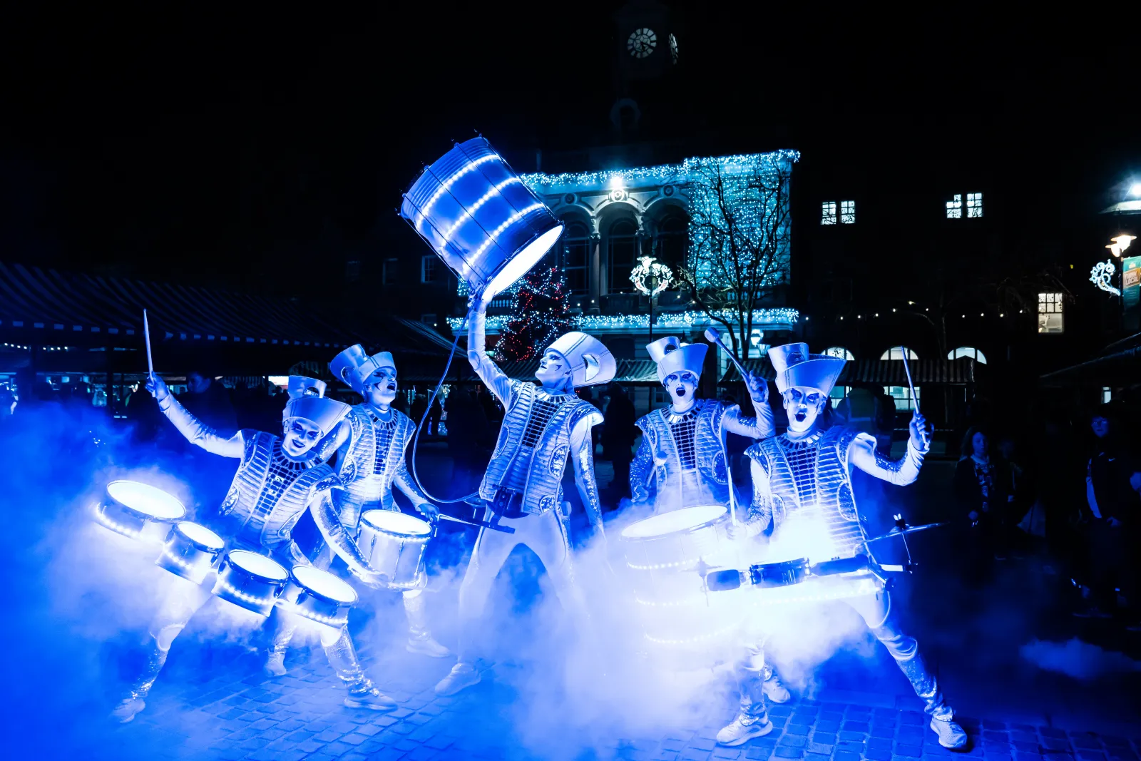 Worldbeaters Spark! performers drumming at a Christmas light switch-on outside Retford town hall.