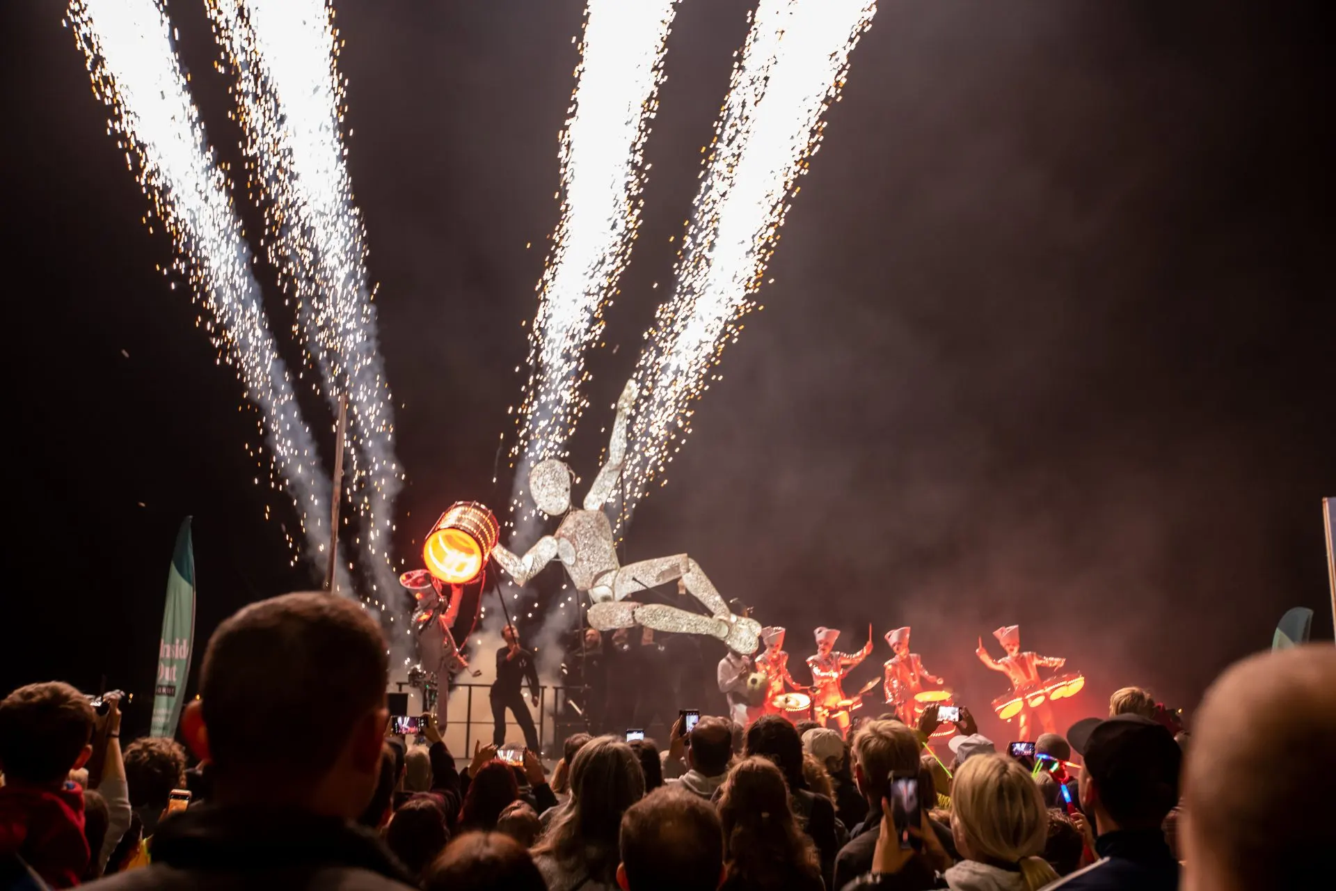 Pyrotechnic fountains erupting above Dundu and the Spark! drummers at the finale in Weymouth, the crowd filming on their phones.